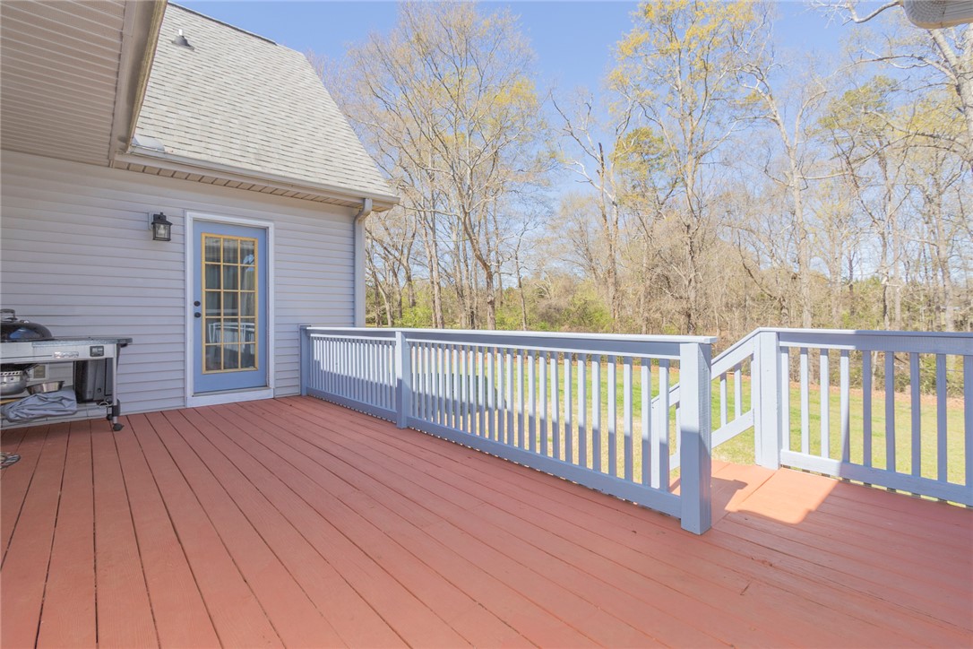 108 Pearman Drive Pendleton, SC 29670 - Photo 38 of 50 Enjoy outdoor living on this expansive wooden deck, perfect for relaxation and entertaining.