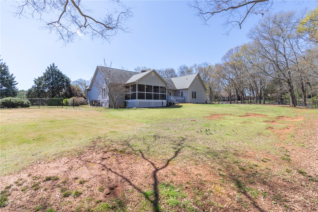 108 Pearman Drive Pendleton, SC 29670 - Photo 48 of 50 The expansive yard and screened porch offer abundant space for outdoor living and relaxation.