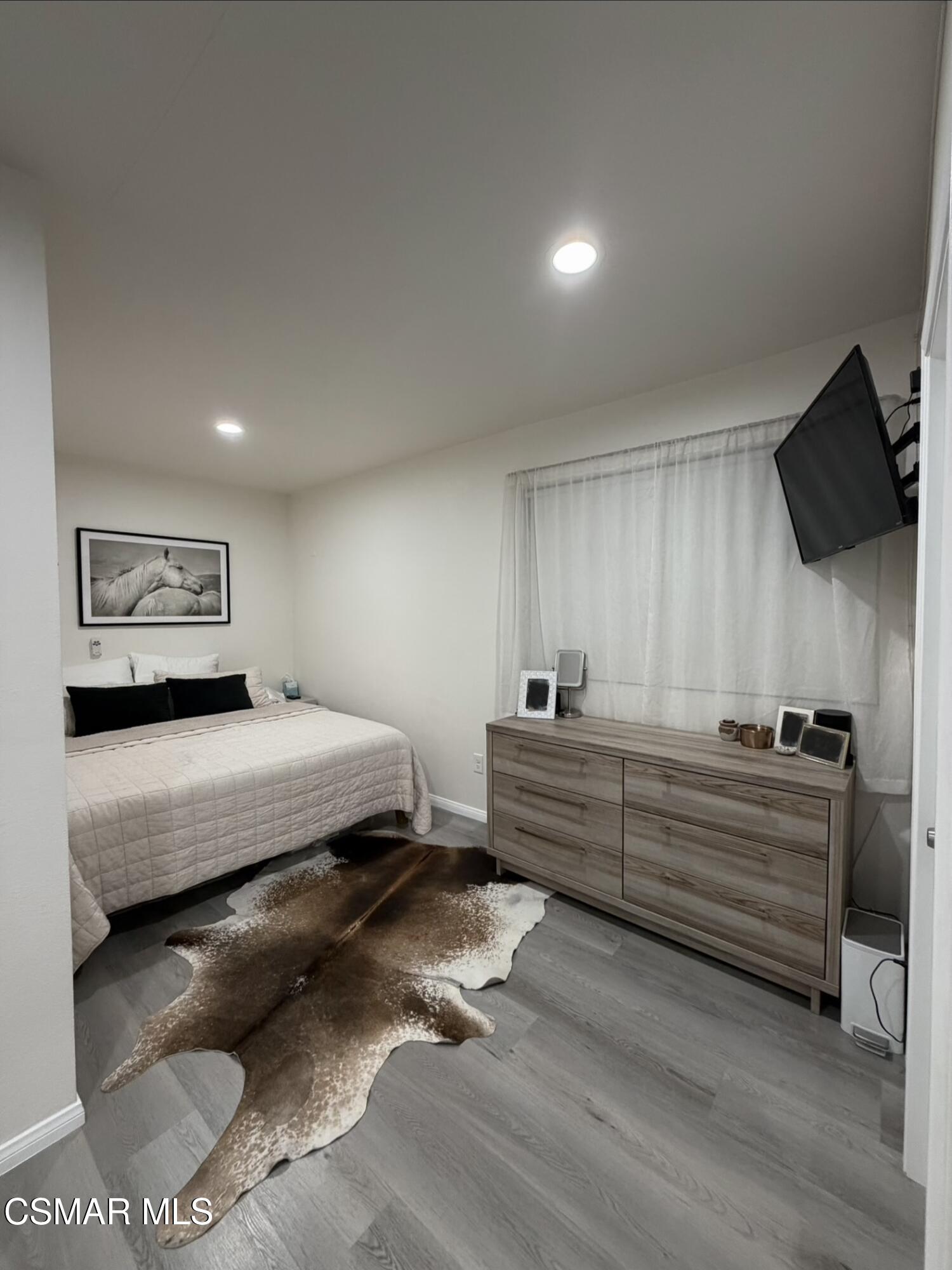 3587 Sweetwood Street, Unit B Simi Valley, CA 93063 - Photo 7 of 11 a bedroom with bed and window