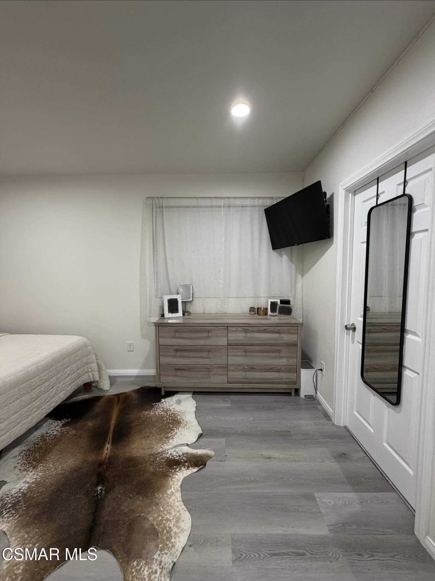 3587 Sweetwood Street, Unit B Simi Valley, CA 93063 - Photo 8 of 11 a room with a bed and a television