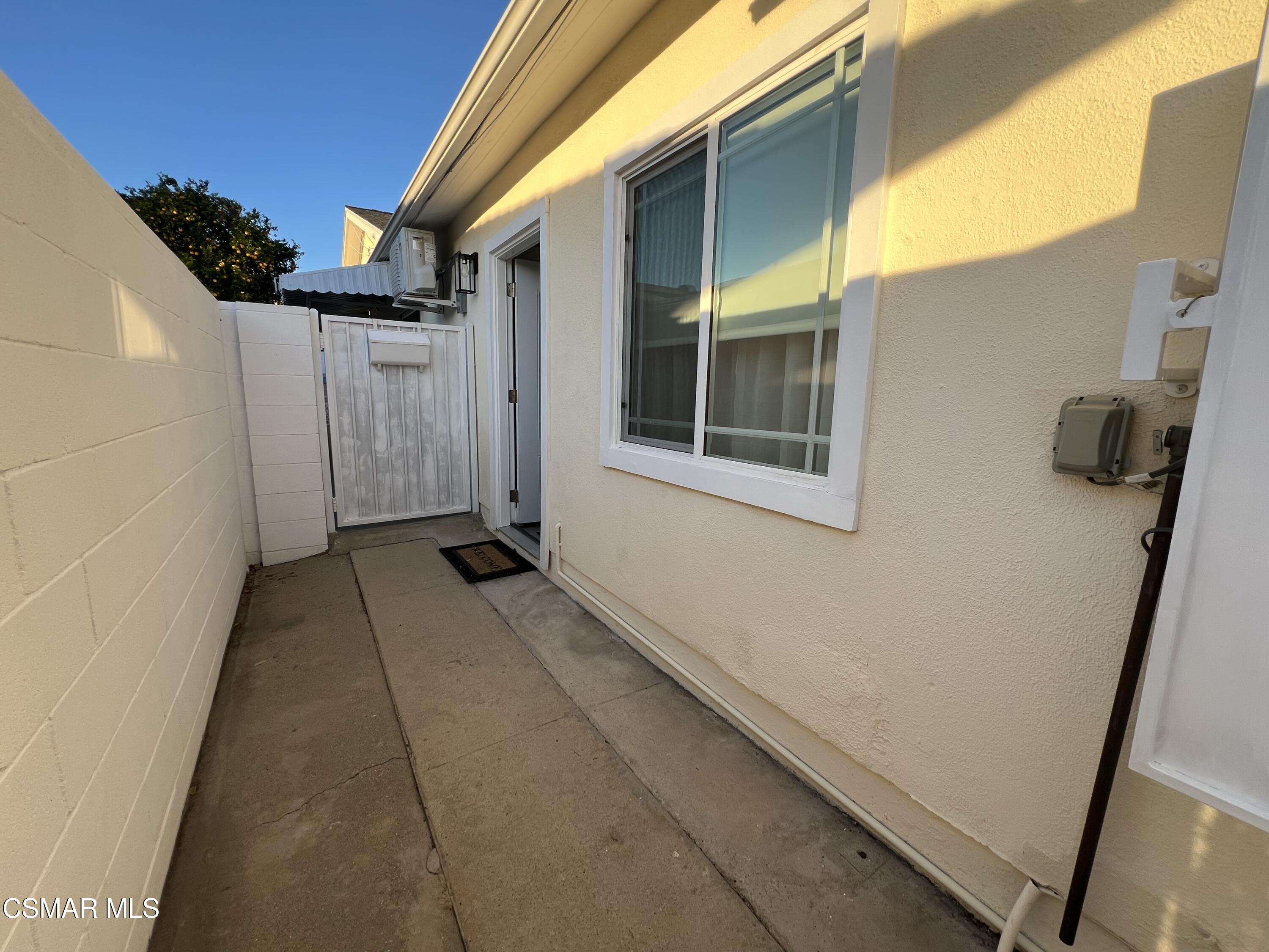 3587 Sweetwood Street, Unit B Simi Valley, CA 93063 - Photo 10 of 11 a view of a house with backyard and glass door