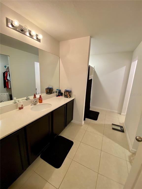 8659 Silverbell Loop Brooksville, FL 34613 - Photo 21 of 36 a kitchen with a sink and a mirror