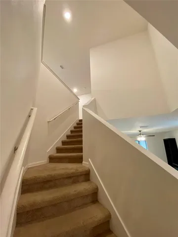 an empty room with a fireplace and a projector