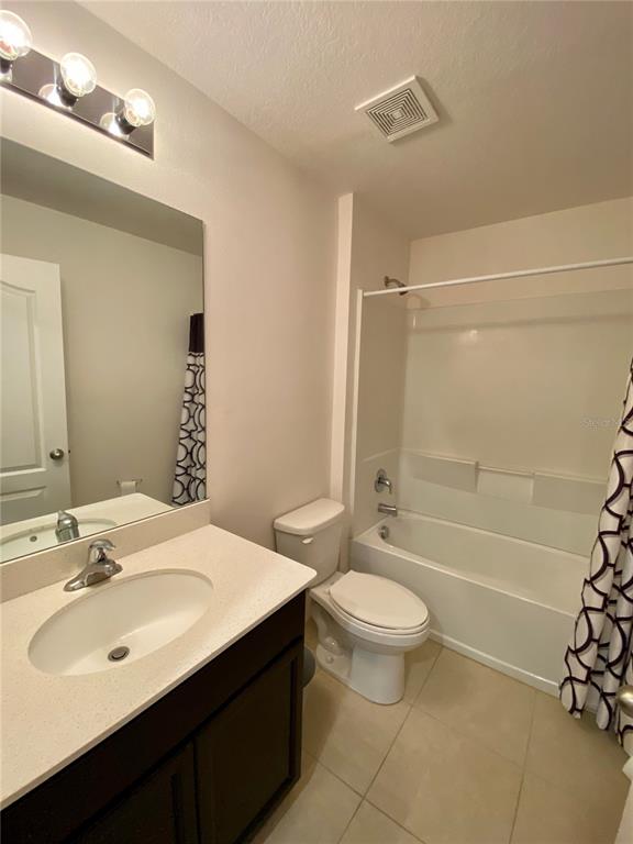 8659 Silverbell Loop Brooksville, FL 34613 - Photo 34 of 36 a bathroom with a sink a toilet and shower