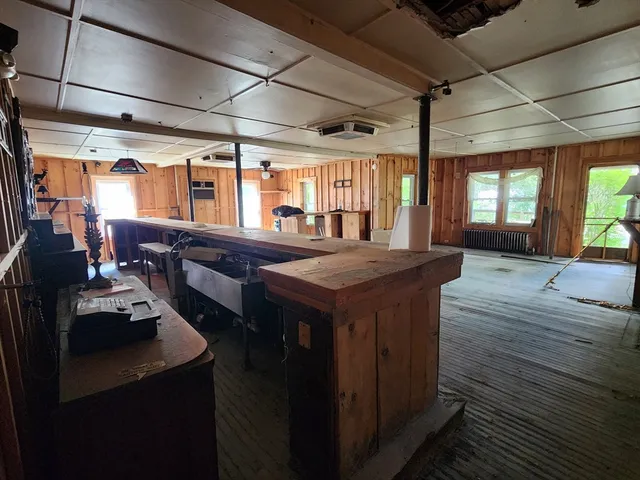 a kitchen with a stove and a refrigerator