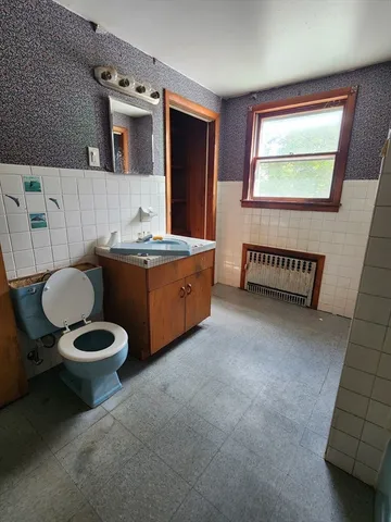 a living room with a furniture and a rug