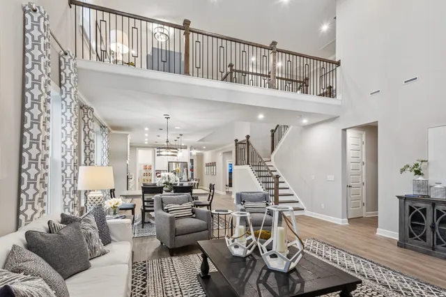 a living room with furniture or couch and a dining table