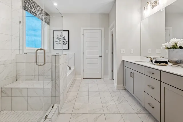 a bathroom with a mirror and a shower