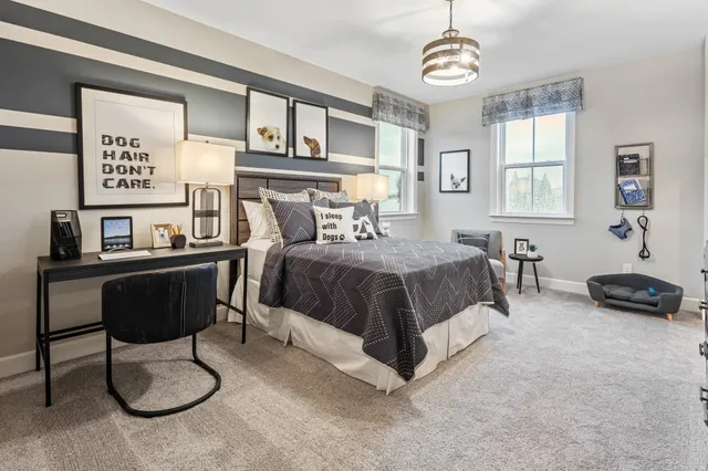 a bedroom with a bed furniture and window