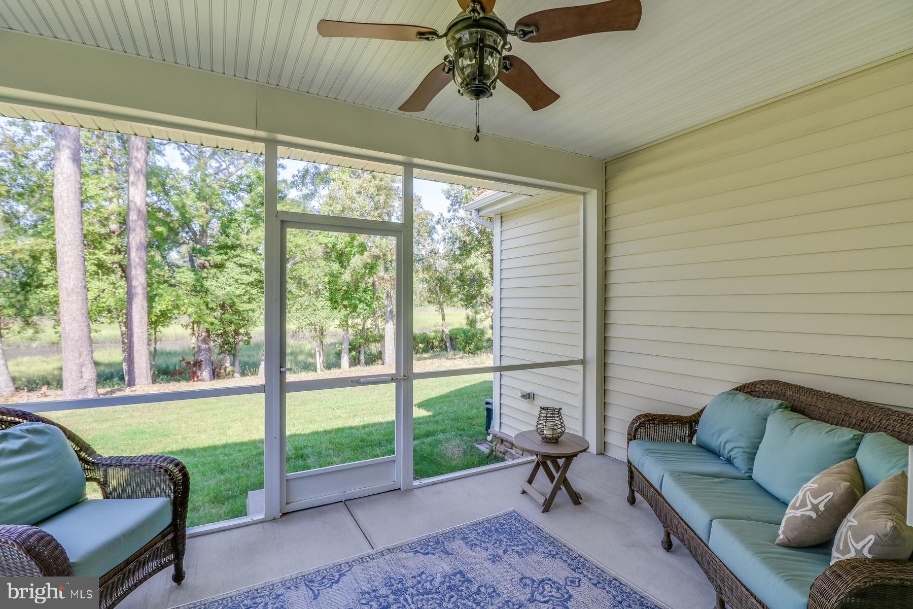 36490 Warwick Drive, Unit 14 Rehoboth Beach, DE 19971 - Photo 7 of 42 Screened porch overlooking Johnson Branch