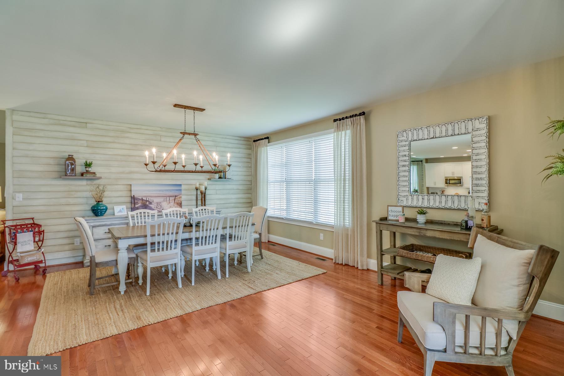 36490 Warwick Drive, Unit 14 Rehoboth Beach, DE 19971 - Photo 10 of 42 Dining room with shiplap and hardwood floors