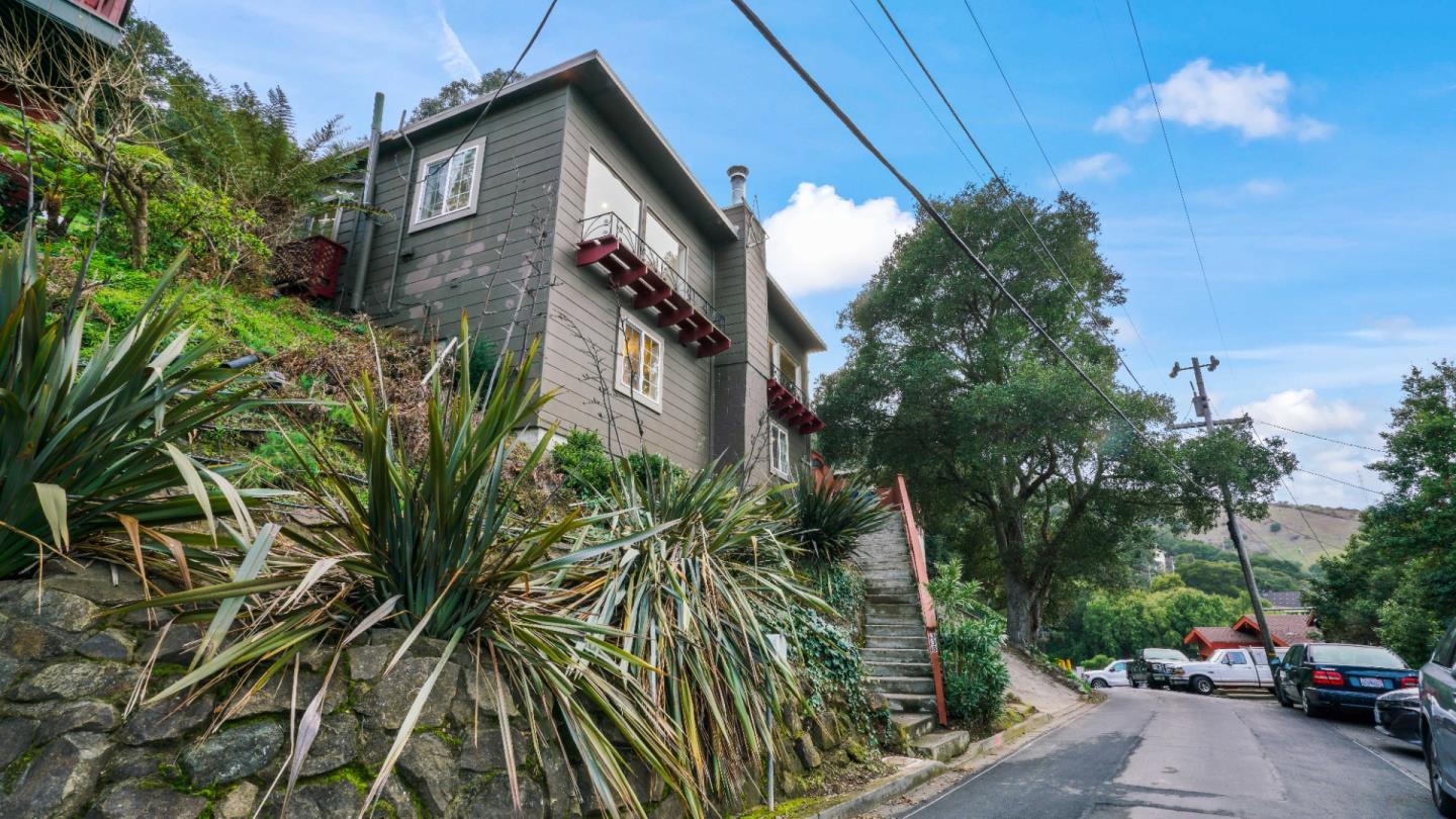 338 Kings Road Brisbane, CA 94005 - Photo 17 of 53 a couple of cars parked in front of a house