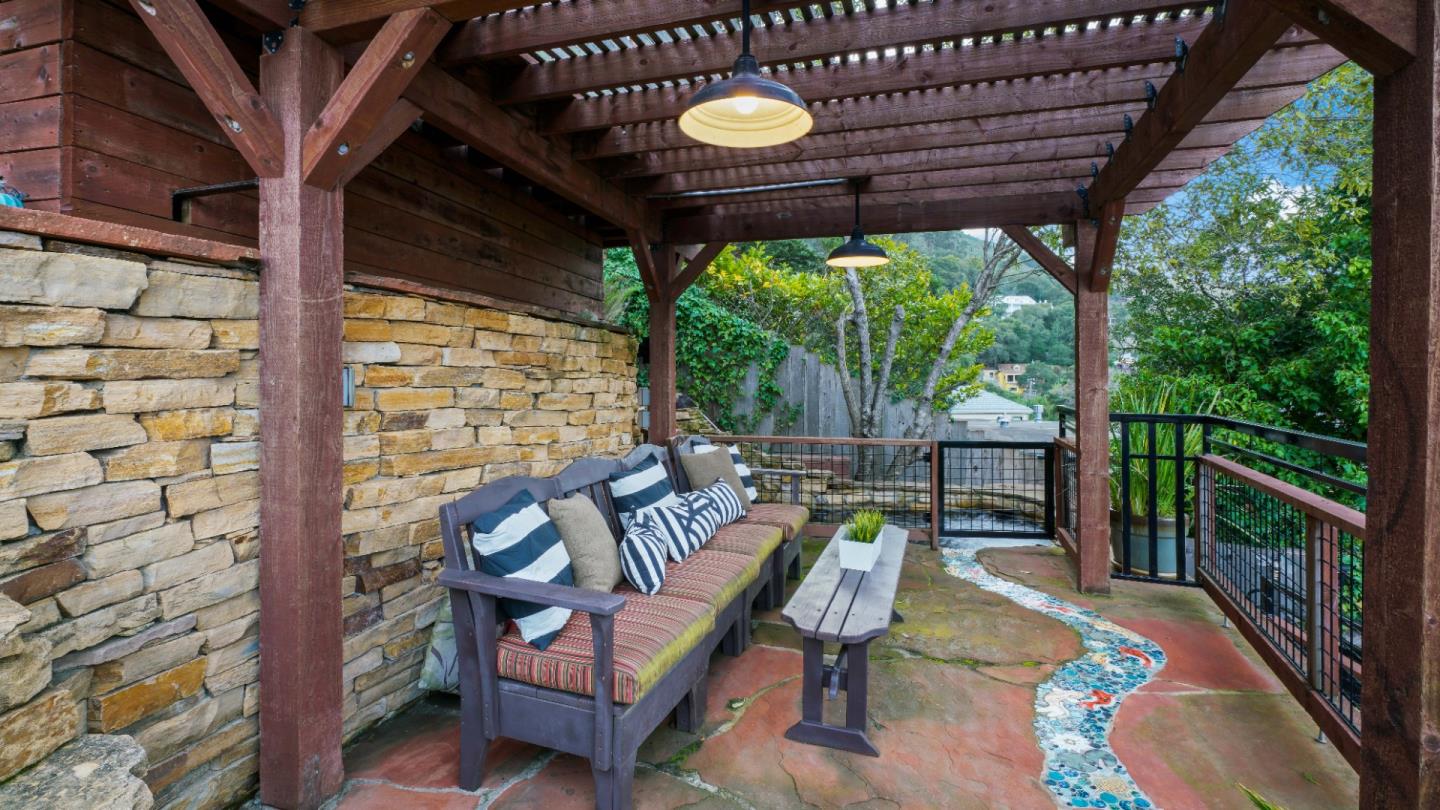 338 Kings Road Brisbane, CA 94005 - Photo 20 of 53 a view of a patio with a table chairs and a backyard