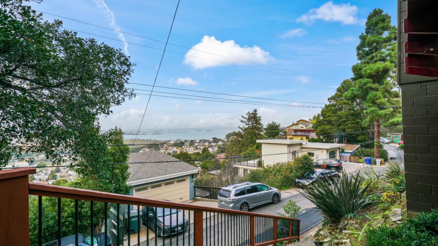 338 Kings Road Brisbane, CA 94005 - Photo 2 of 53 a view of a balcony with couches and wooden floor