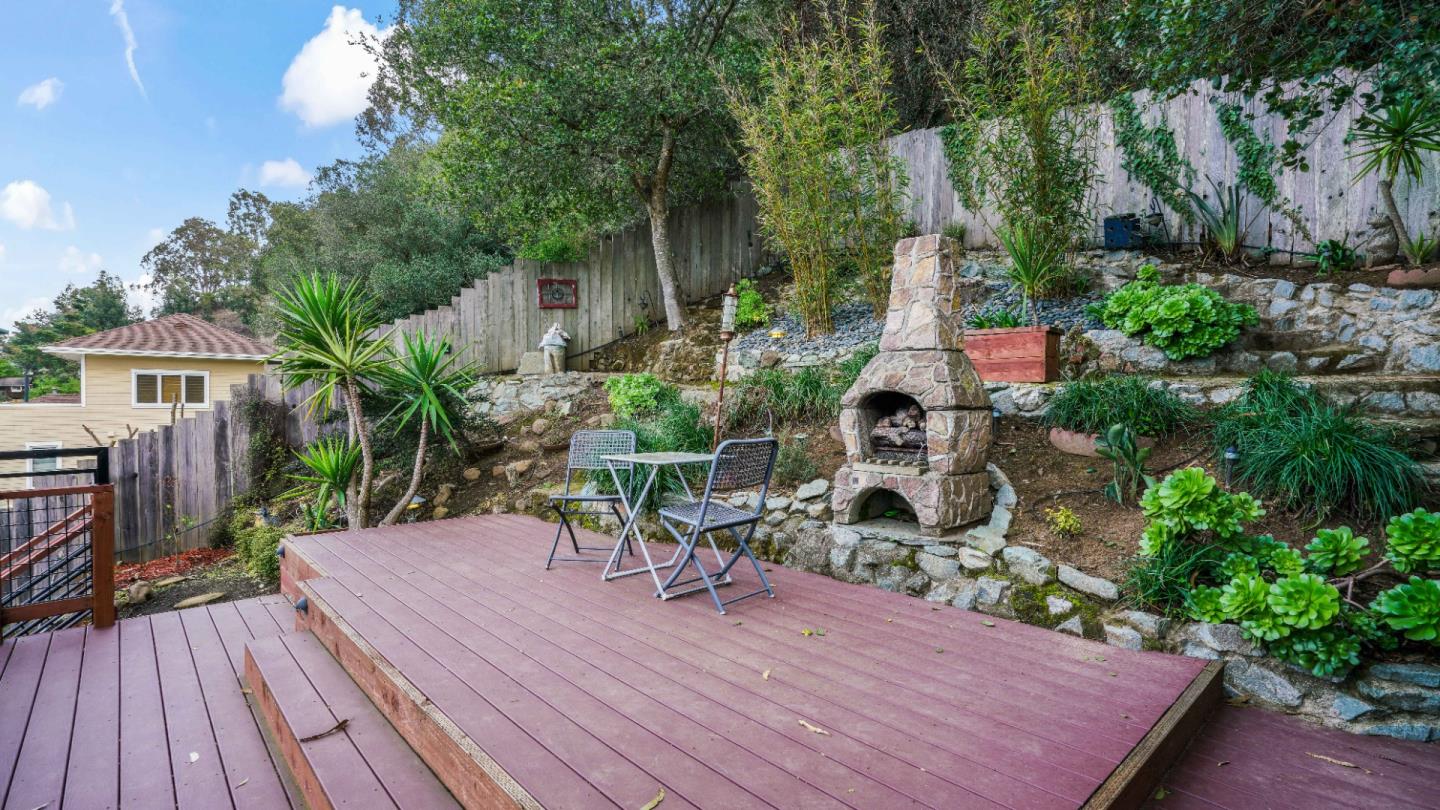 338 Kings Road Brisbane, CA 94005 - Photo 23 of 53 a backyard of a house with wooden floor yard and outdoor seating