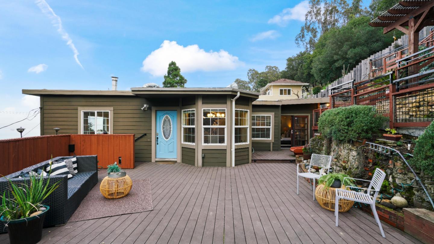 338 Kings Road Brisbane, CA 94005 - Photo 27 of 53 a front view of a house with outdoor seating