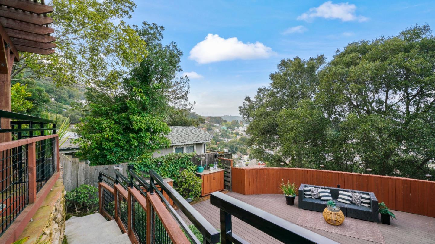 338 Kings Road Brisbane, CA 94005 - Photo 29 of 53 a view of a patio with couches table and chairs and potted plants