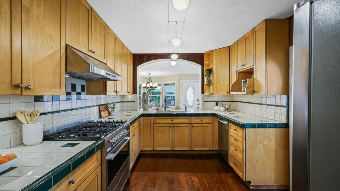 338 Kings Road Brisbane, CA 94005 - Photo 34 of 53 a kitchen with a sink stove and cabinets