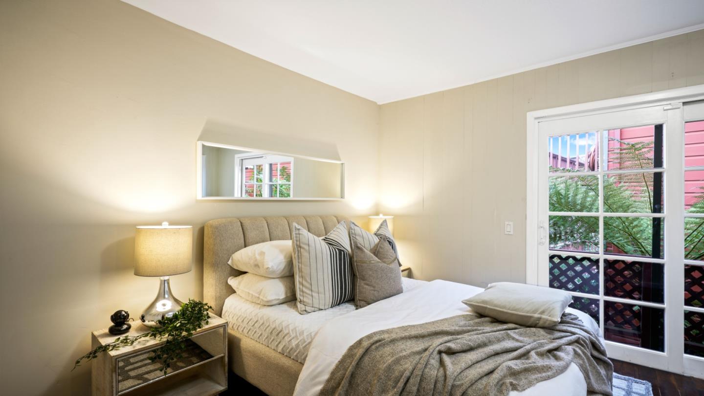 338 Kings Road Brisbane, CA 94005 - Photo 48 of 53 a bedroom with a bed and a lamp