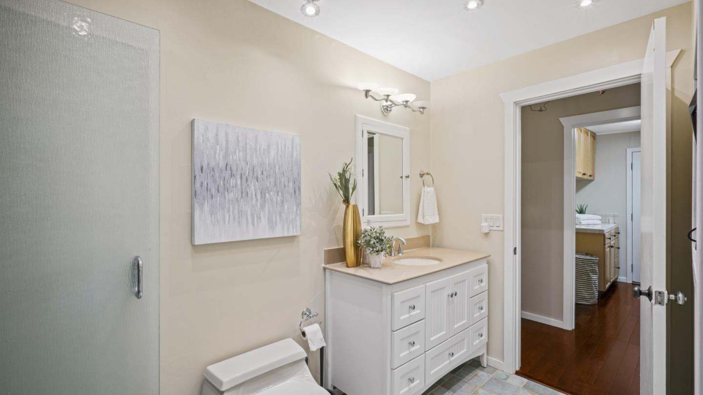338 Kings Road Brisbane, CA 94005 - Photo 49 of 53 a bathroom with a double vanity sink mirror and shower
