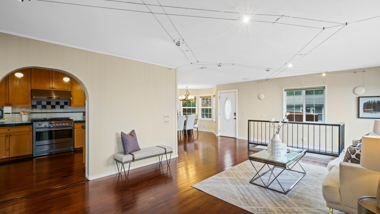 338 Kings Road Brisbane, CA 94005 - Photo 7 of 53 a living room with furniture and a wooden floor