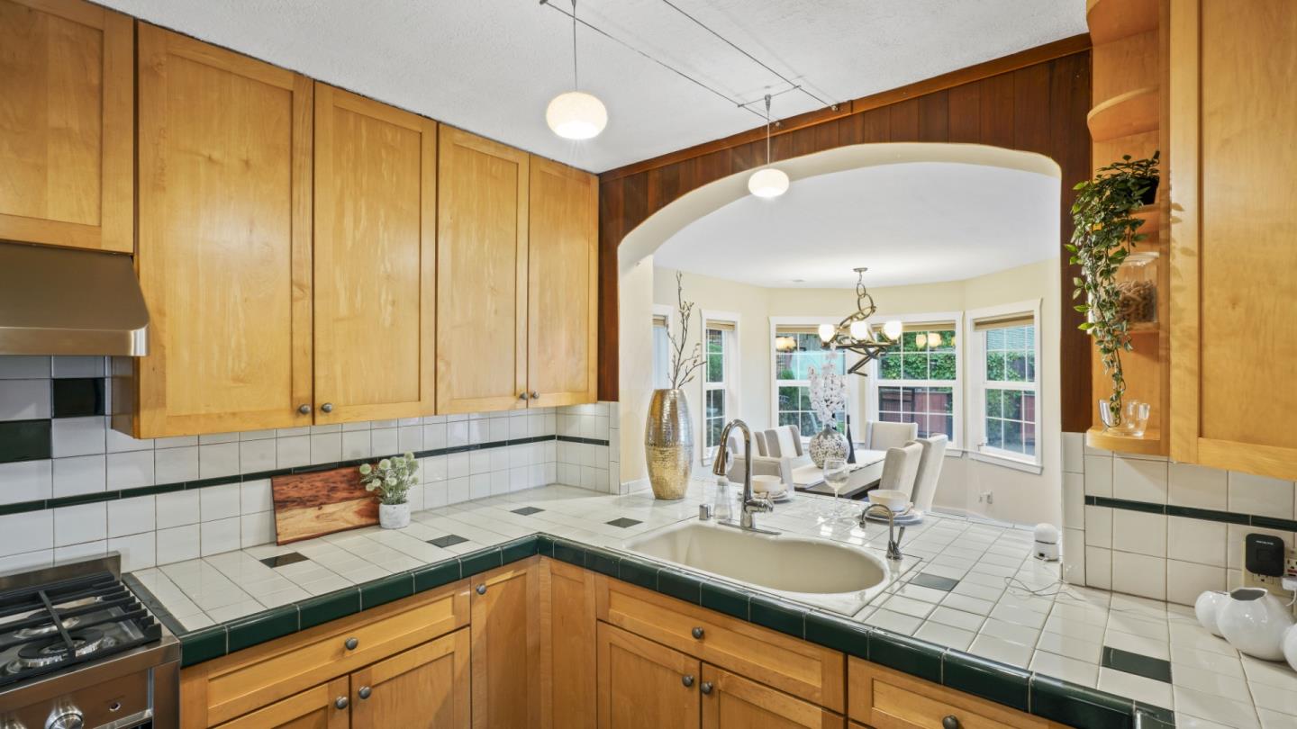 338 Kings Road Brisbane, CA 94005 - Photo 9 of 53 a kitchen with a sink a counter top space and cabinets