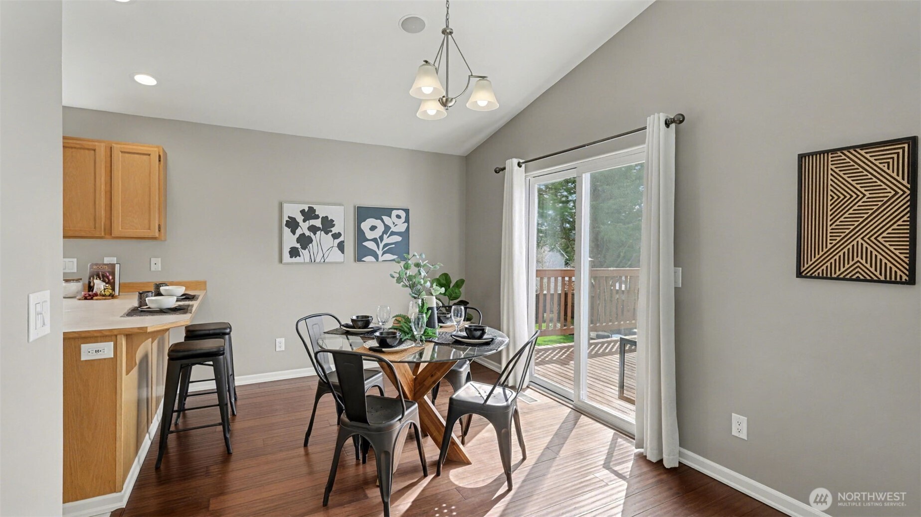 132 76th Place Southwest Everett, WA 98203 - Photo 12 of 36 a view of a dining room with furniture window and wooden floor