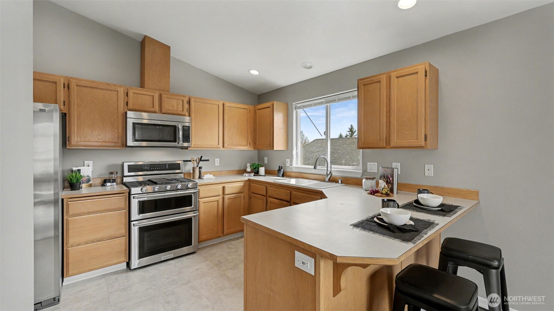132 76th Place Southwest Everett, WA 98203 - Photo 14 of 36 a kitchen with a sink stove top oven and microwave