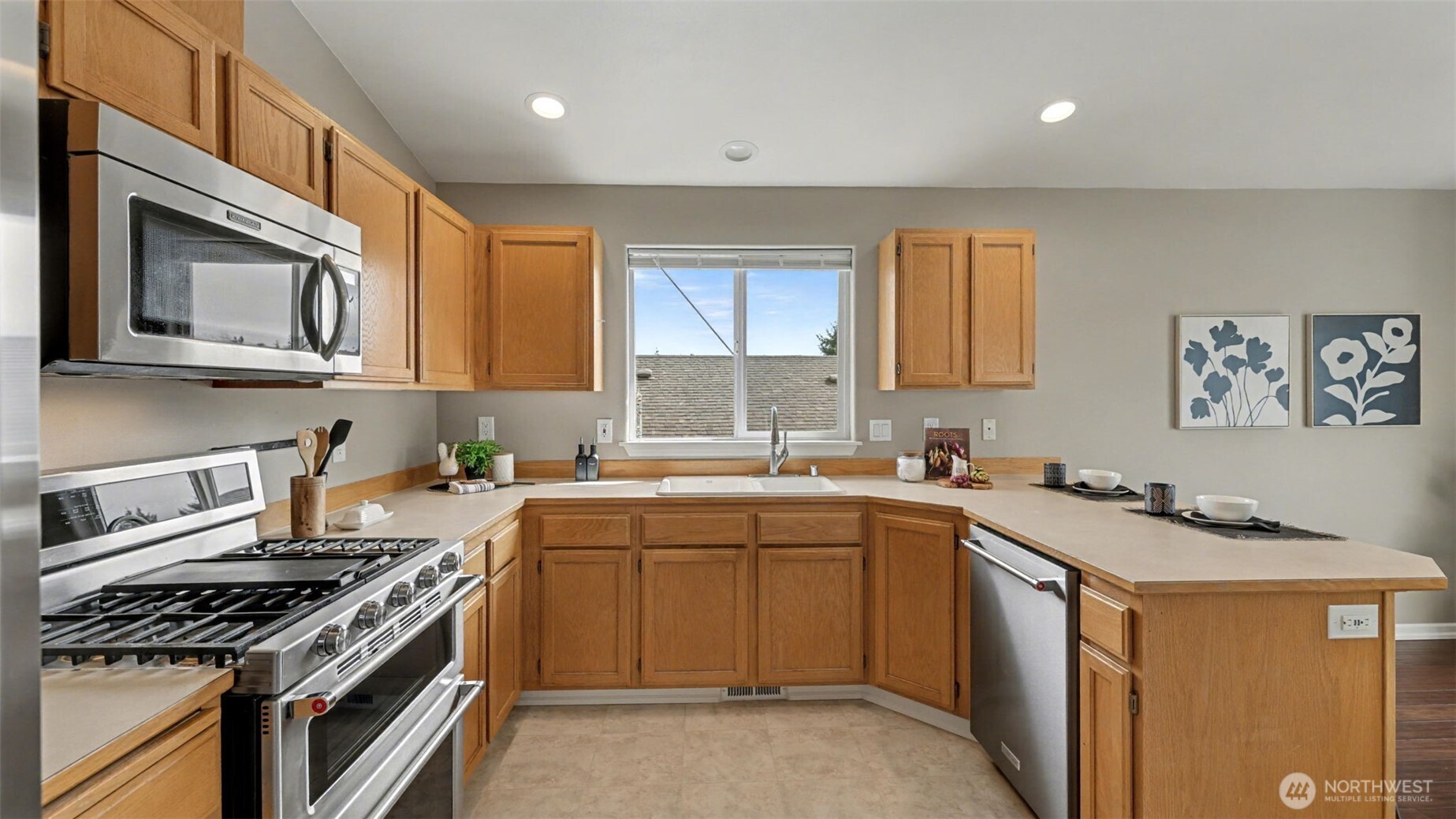 132 76th Place Southwest Everett, WA 98203 - Photo 18 of 36 a kitchen with a sink stove top oven and cabinets