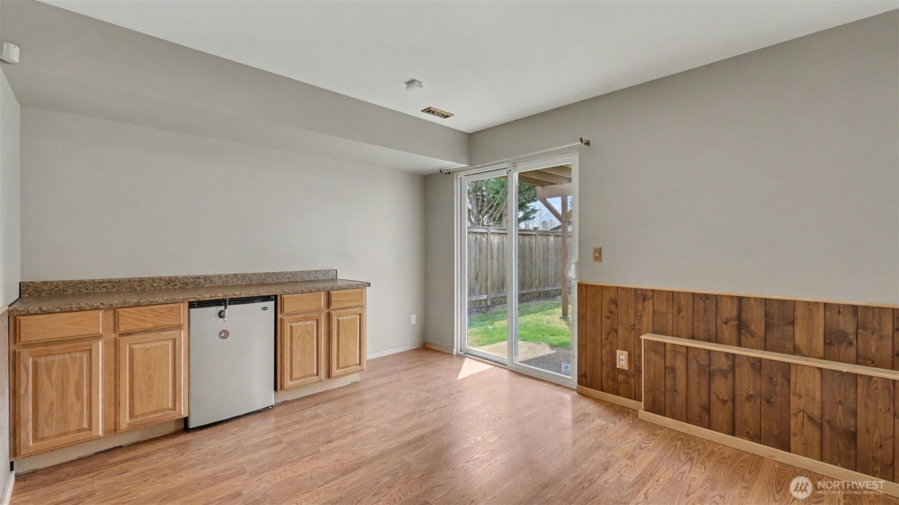 132 76th Place Southwest Everett, WA 98203 - Photo 35 of 36 a view of an empty room with wooden floor and a window