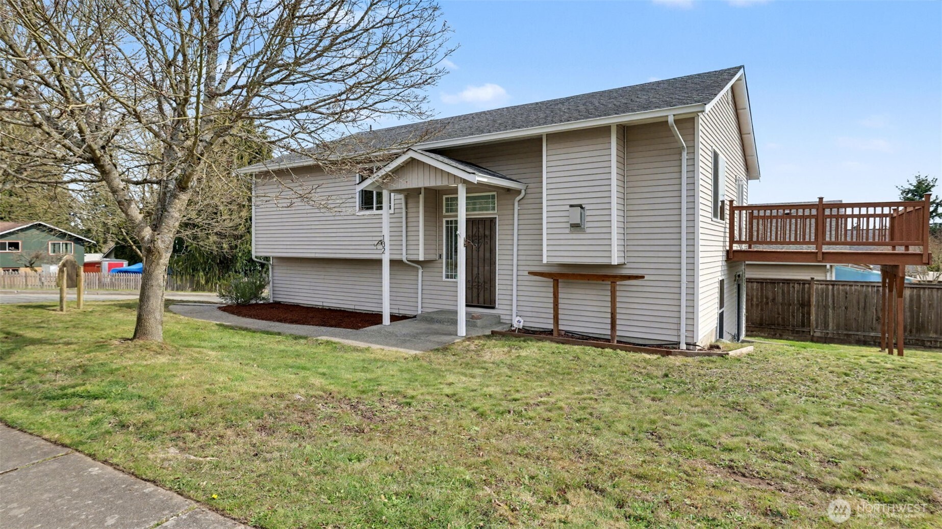 132 76th Place Southwest Everett, WA 98203 - Photo 4 of 36 a view of a house with a yard and garage