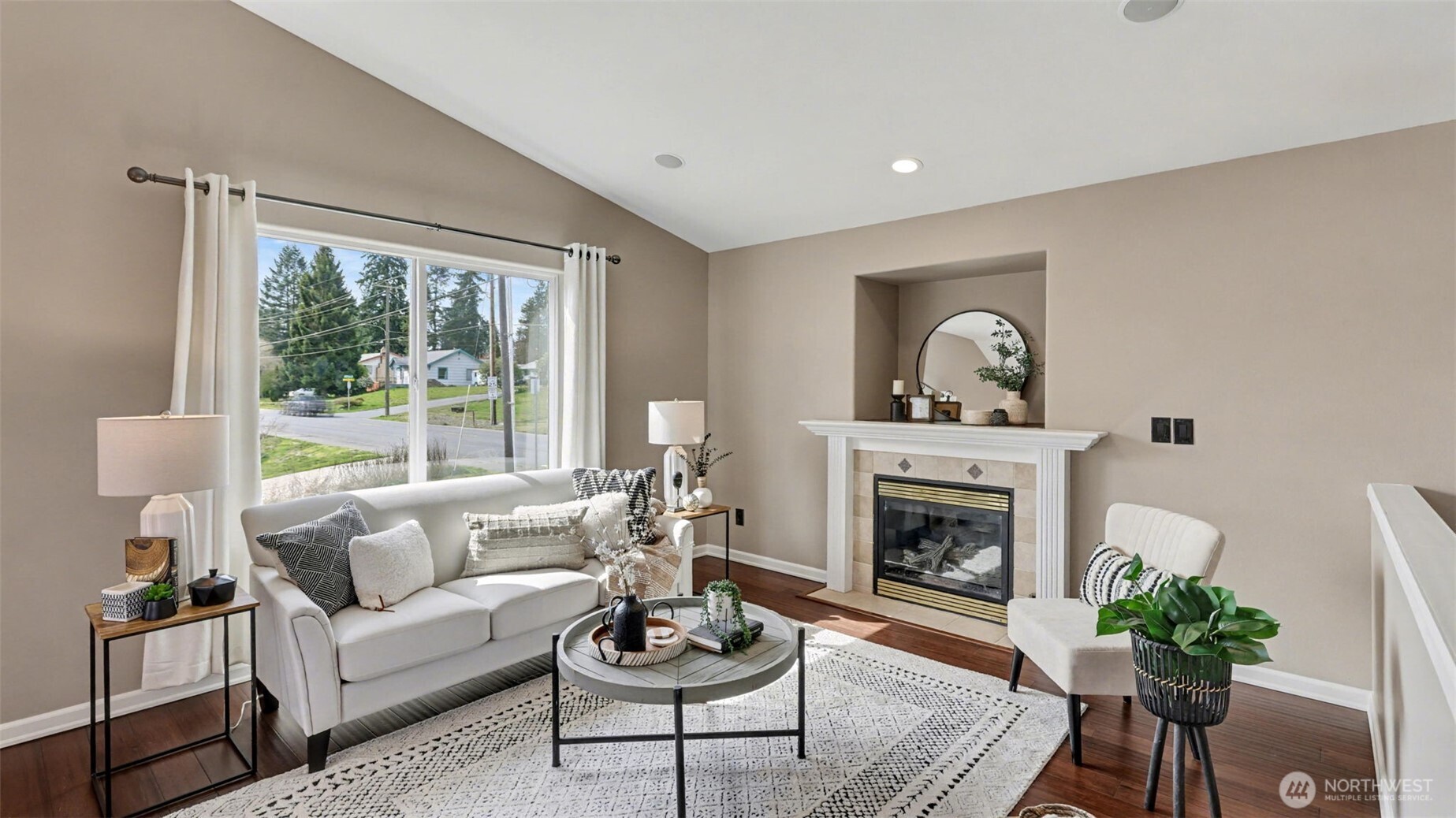 132 76th Place Southwest Everett, WA 98203 - Photo 9 of 36 a living room with furniture and a fireplace
