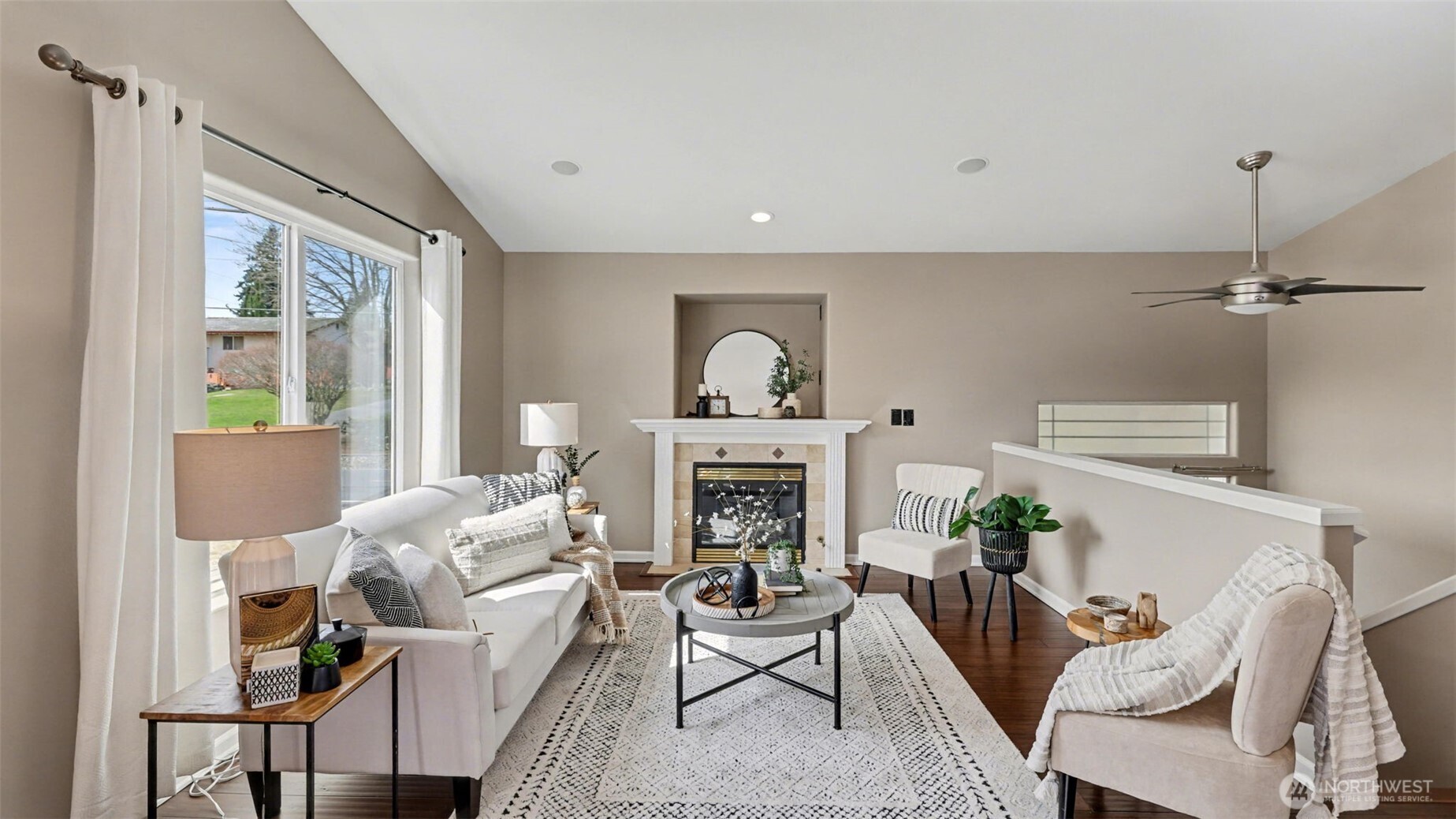 132 76th Place Southwest Everett, WA 98203 - Photo 10 of 36 a living room with furniture a fireplace and a potted plant