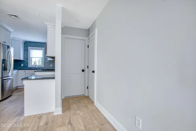 a view of a kitchen cabinets and wooden floor