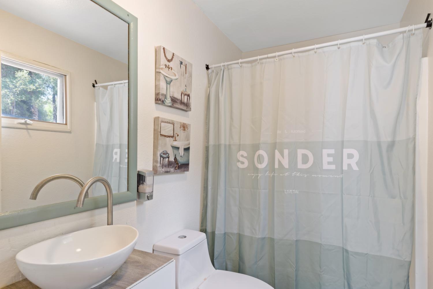 40707 Jean Road East Oakhurst, CA 93644 - Photo 11 of 44 a bathroom with a sink and a mirror