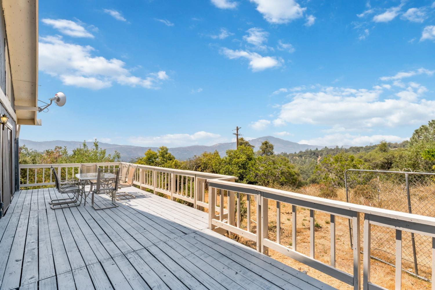 40707 Jean Road East Oakhurst, CA 93644 - Photo 14 of 44 a view of roof deck with two chairs and wooden floor