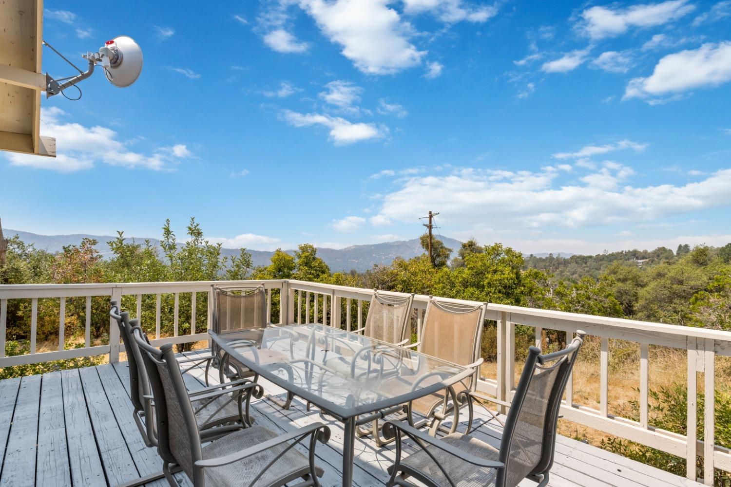 40707 Jean Road East Oakhurst, CA 93644 - Photo 15 of 44 a view of a balcony with furniture