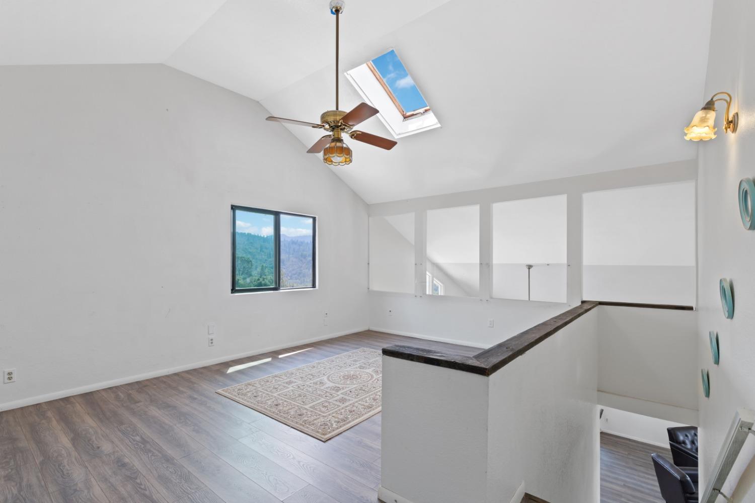 40707 Jean Road East Oakhurst, CA 93644 - Photo 18 of 44 a room with window and ceiling fan