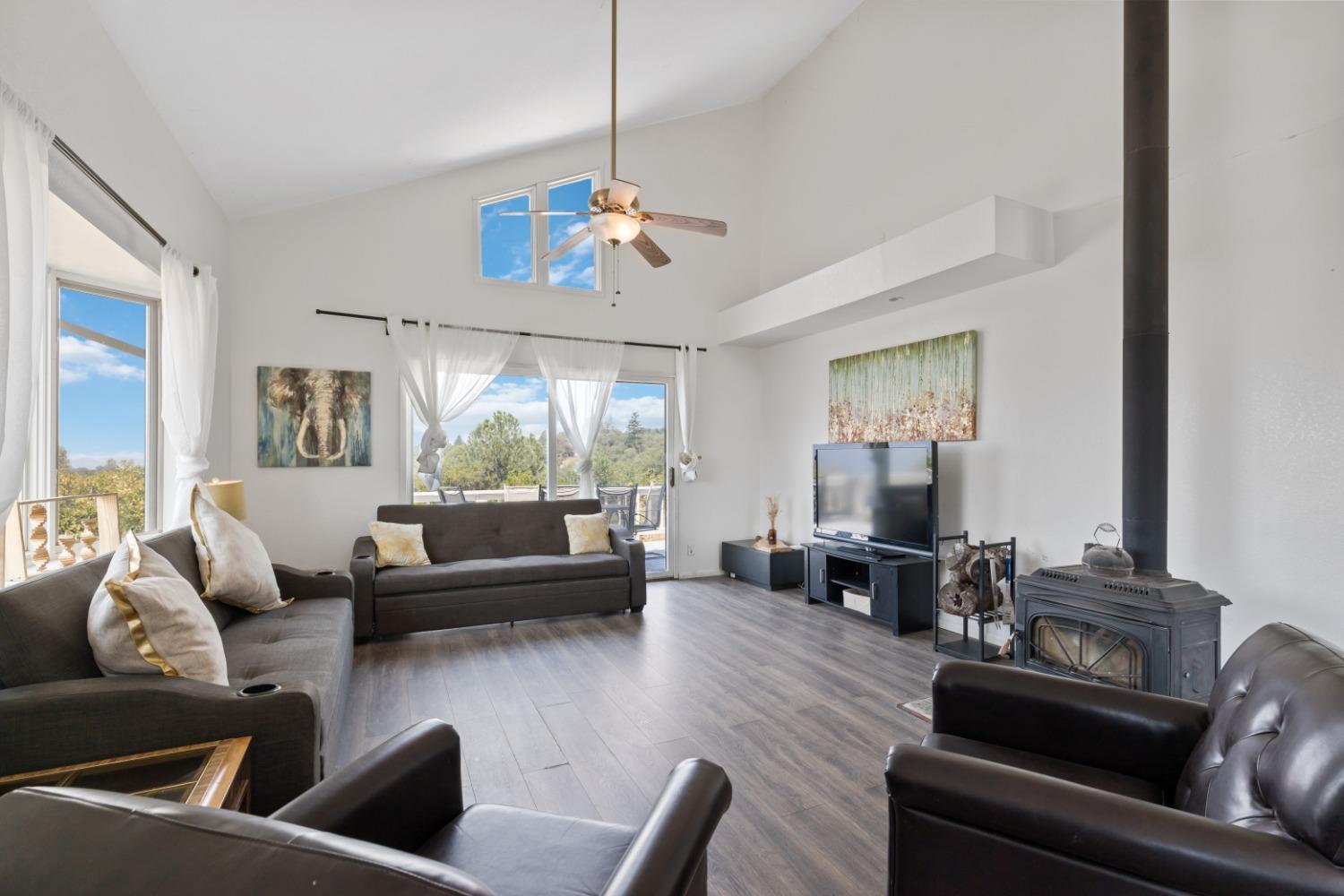 40707 Jean Road East Oakhurst, CA 93644 - Photo 2 of 44 a living room with furniture or chandelier and a wooden floor
