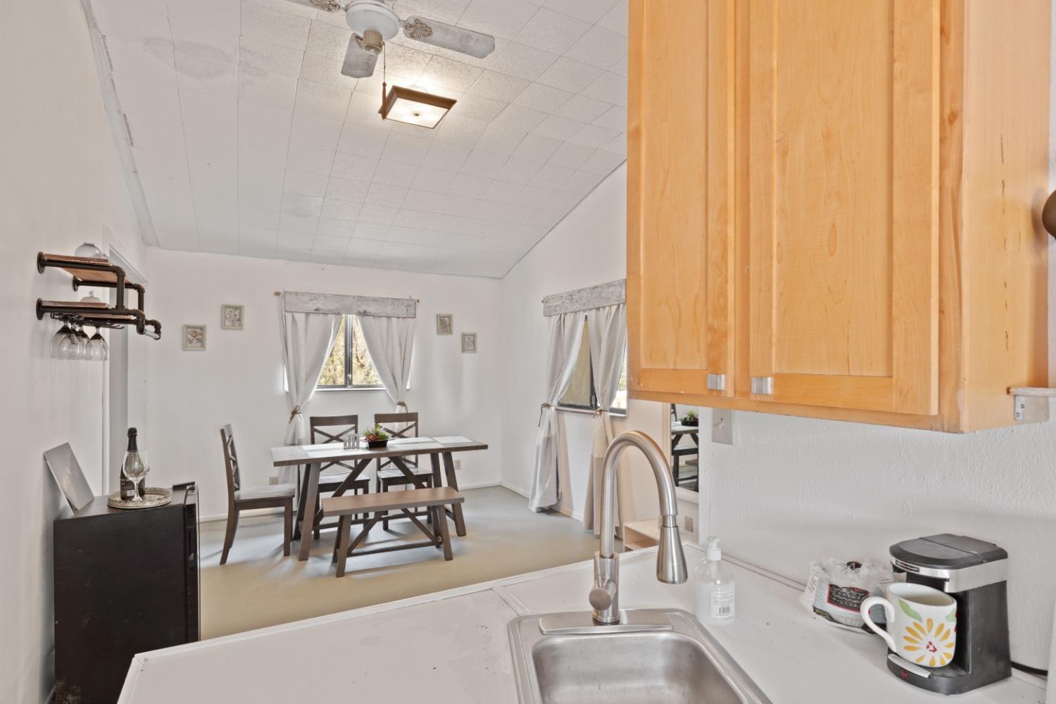 40707 Jean Road East Oakhurst, CA 93644 - Photo 34 of 44 a dining room with furniture and window