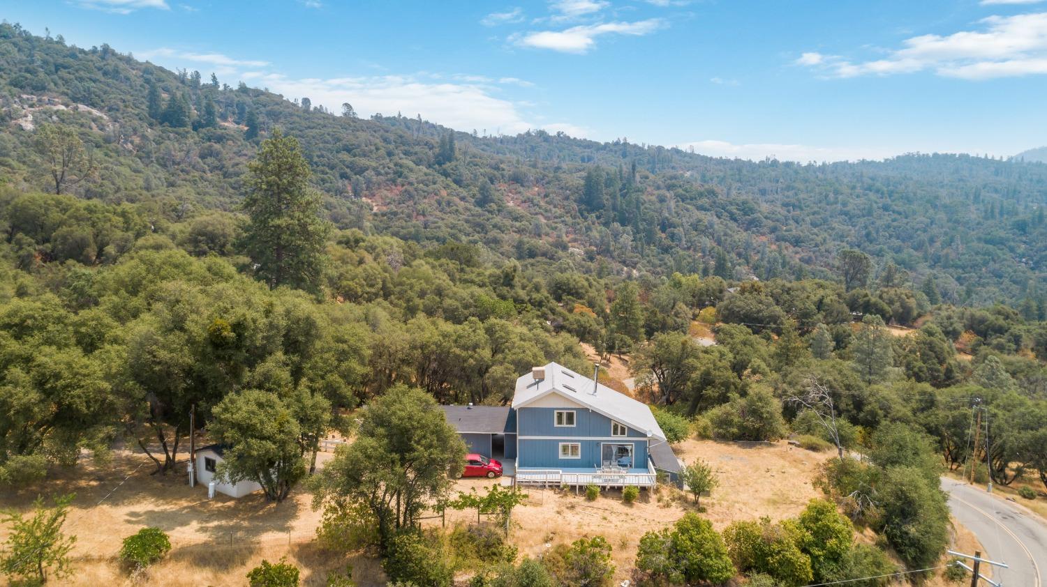 40707 Jean Road East Oakhurst, CA 93644 - Photo 38 of 44 a view of a houses with a yard