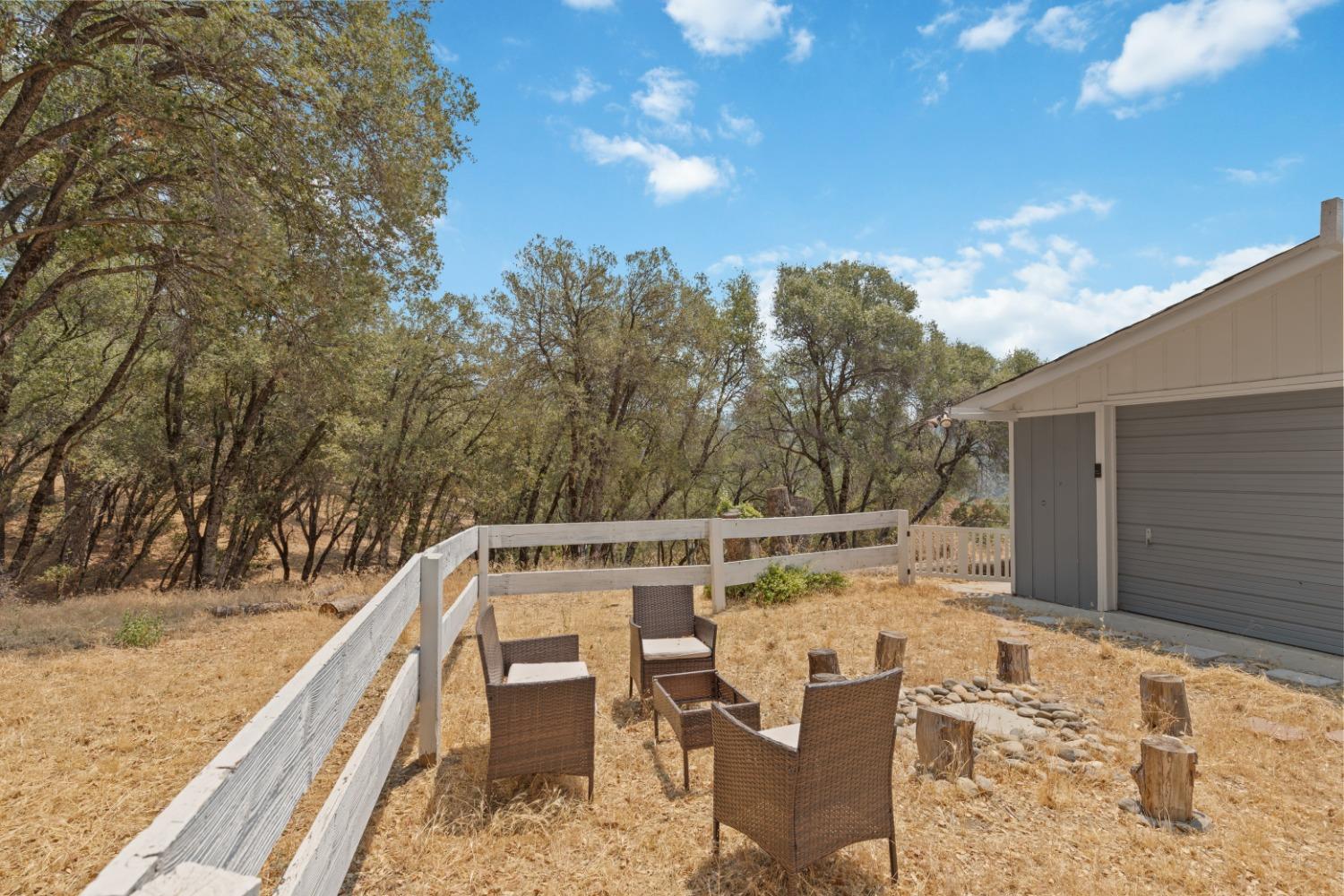 40707 Jean Road East Oakhurst, CA 93644 - Photo 44 of 44 a view of roof deck with chairs and wooden fence