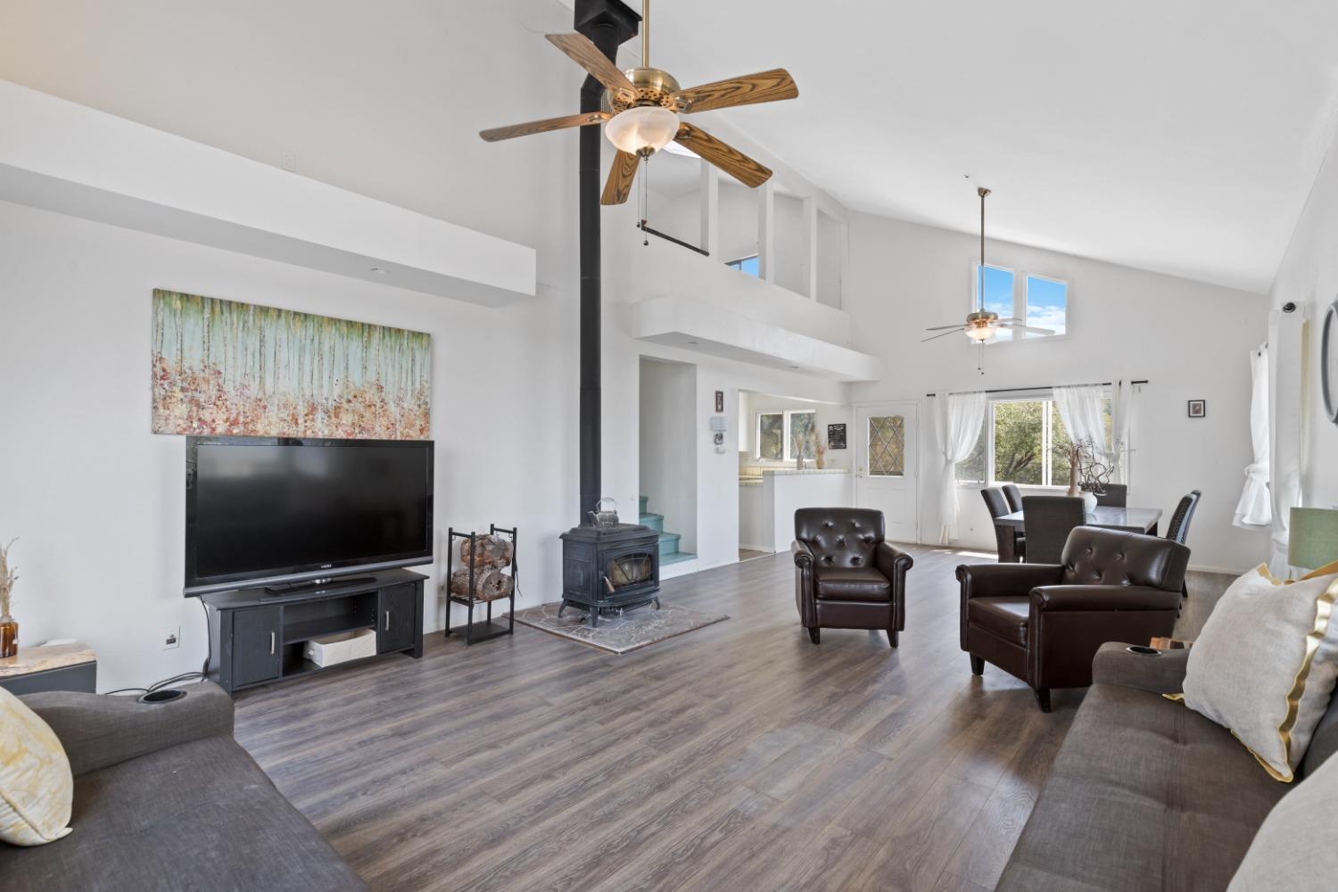 40707 Jean Road East Oakhurst, CA 93644 - Photo 5 of 44 a living room with furniture and a flat screen tv
