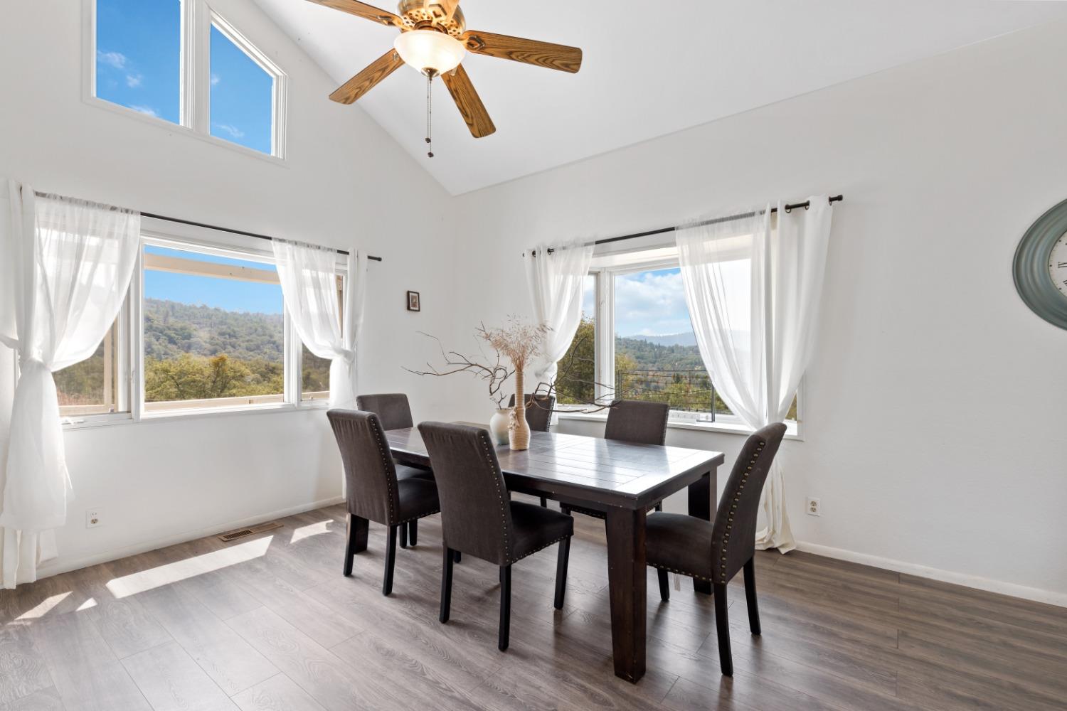 40707 Jean Road East Oakhurst, CA 93644 - Photo 6 of 44 a view of a dining room with furniture window and wooden floor