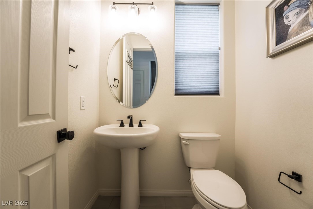 128 Kimberlite Drive Henderson, NV 89011 - Photo 14 of 55 Half bath featuring baseboards and tile patterned floors