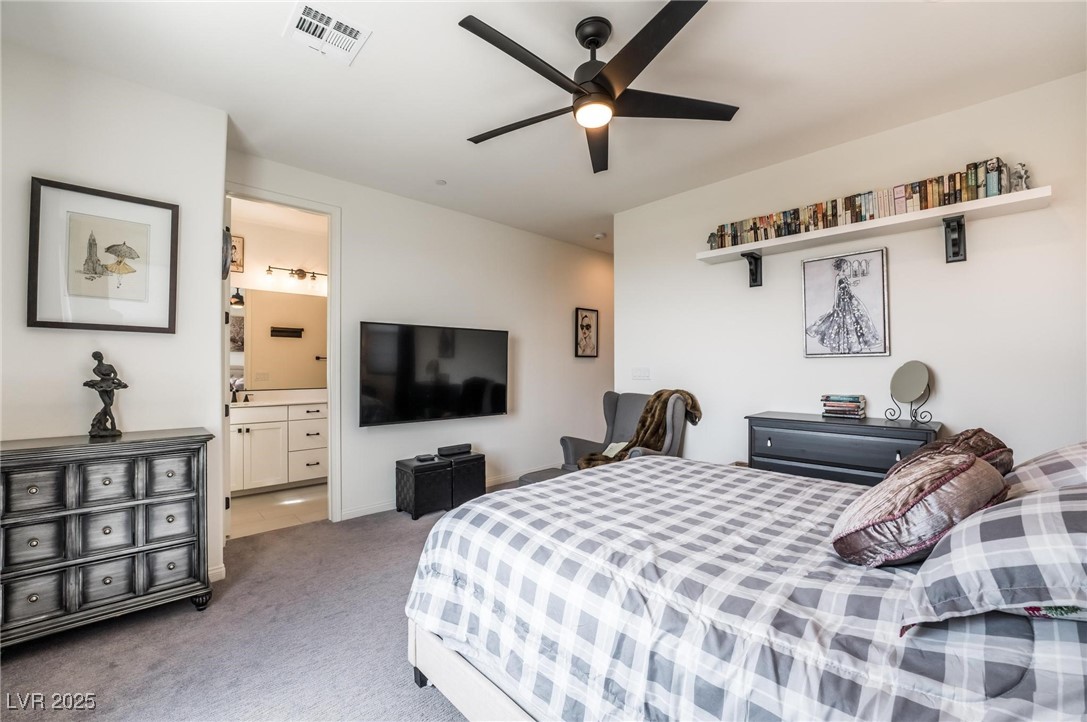 128 Kimberlite Drive Henderson, NV 89011 - Photo 17 of 55 Bedroom featuring light colored carpet and a ceiling fan