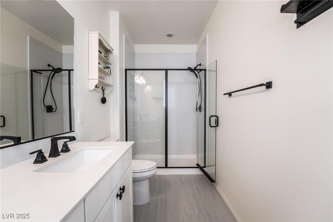 128 Kimberlite Drive Henderson, NV 89011 - Photo 19 of 55 Bathroom featuring vanity and a stall shower