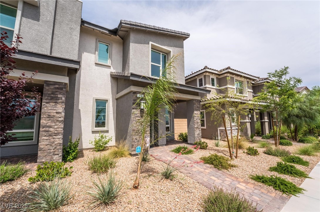 128 Kimberlite Drive Henderson, NV 89011 - Photo 2 of 55 View of front of property featuring stucco siding and stone siding
