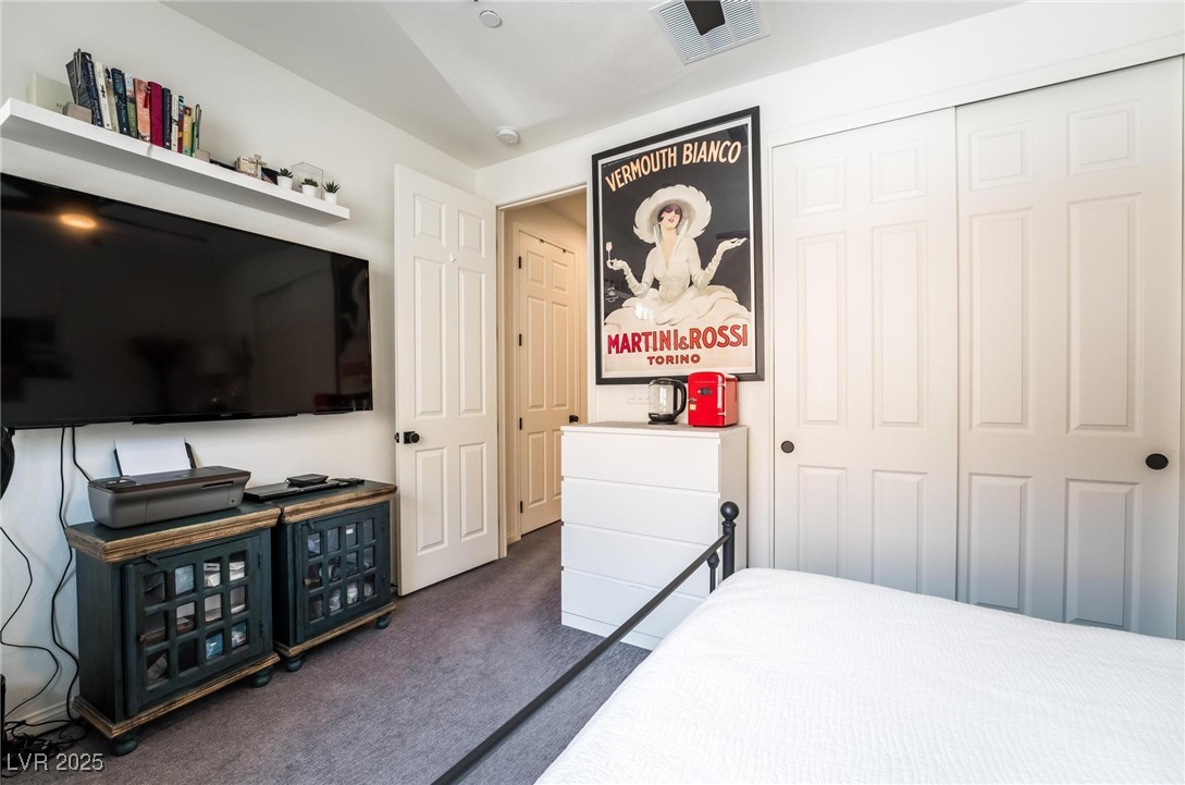 128 Kimberlite Drive Henderson, NV 89011 - Photo 21 of 55 Bedroom featuring dark carpet and a closet