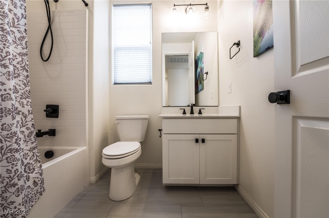 128 Kimberlite Drive Henderson, NV 89011 - Photo 26 of 55 Full bathroom with vanity, shower / bath combo, and light tile patterned floors